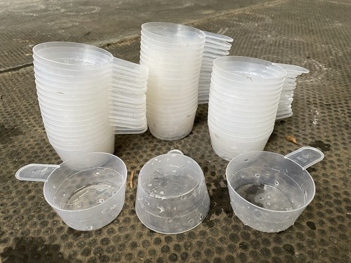 Plastic measuring scoops - plastic,